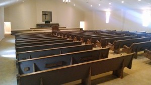 Church pews with book racks