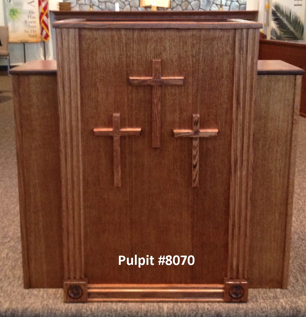 wooden pulpit with three crosses
