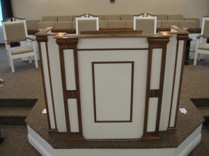 white and wooden pulpit