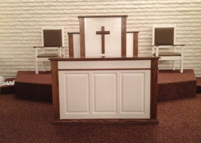 white pulpit with cross